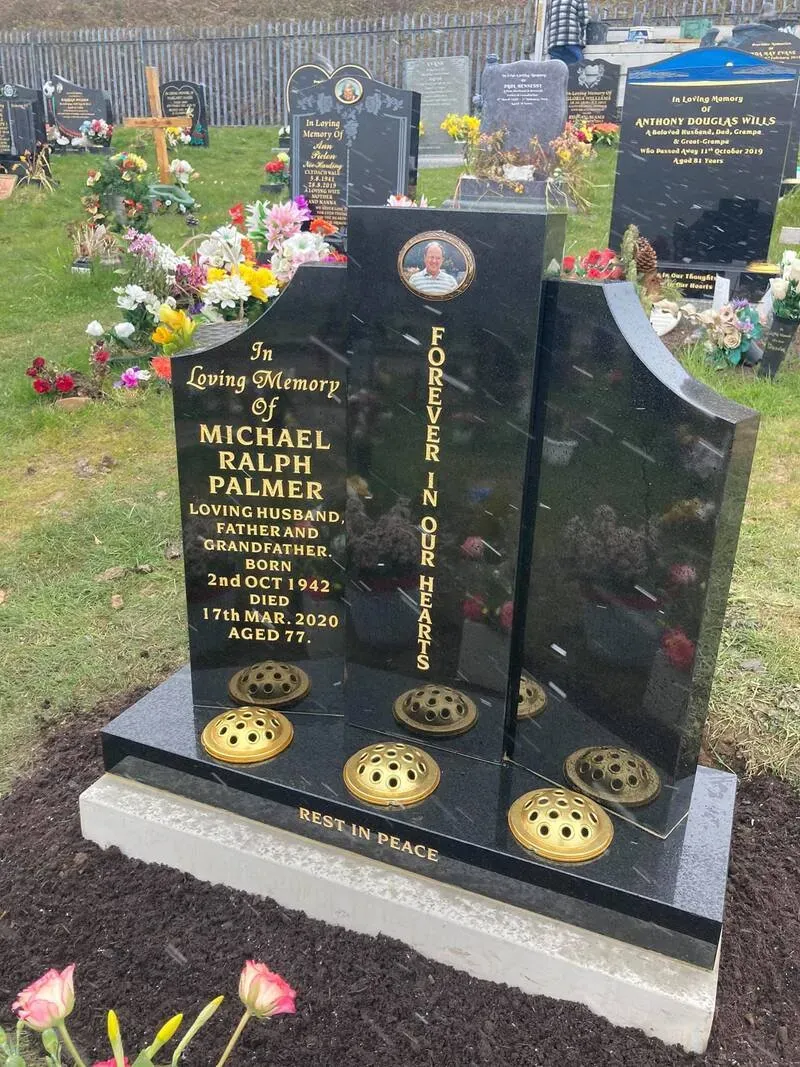 Contemporary sculpted black granite memorial with a ceramic portrait inset, gold leaf lettering and brass vases by FR Terrazzo, Rhondda Cynon Taff